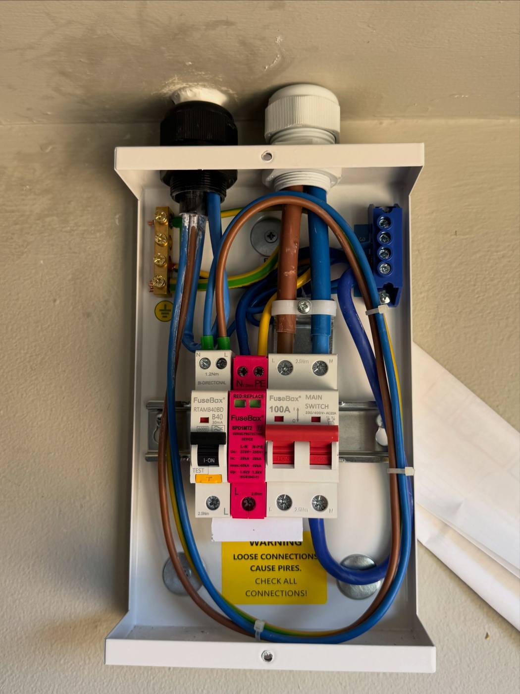 Dedicated EV consumer unit with the cover removed, showing neatly dressed wiring and protective devices before completion